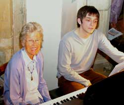 Delphine Wass (page turner) and Adam Brady (pianist) at the piano