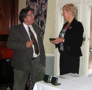 Kevin receiving the medal at the Farmers Club in Whitehall