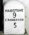 Milestone outside the Post Office in the centre of the Village
